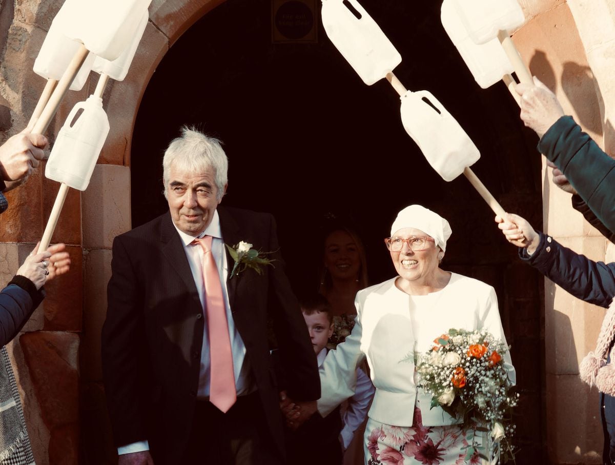 The happy couple emerge from St Mary's in Llanfair Caereinion