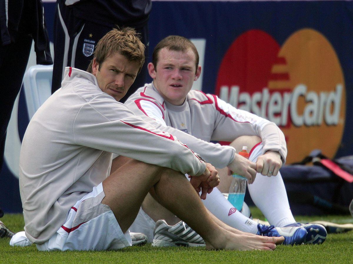 England's captain David Beckham and Wayne Rooney take a break during a training session at Mittelbergstadion in Buhlertal, Germany