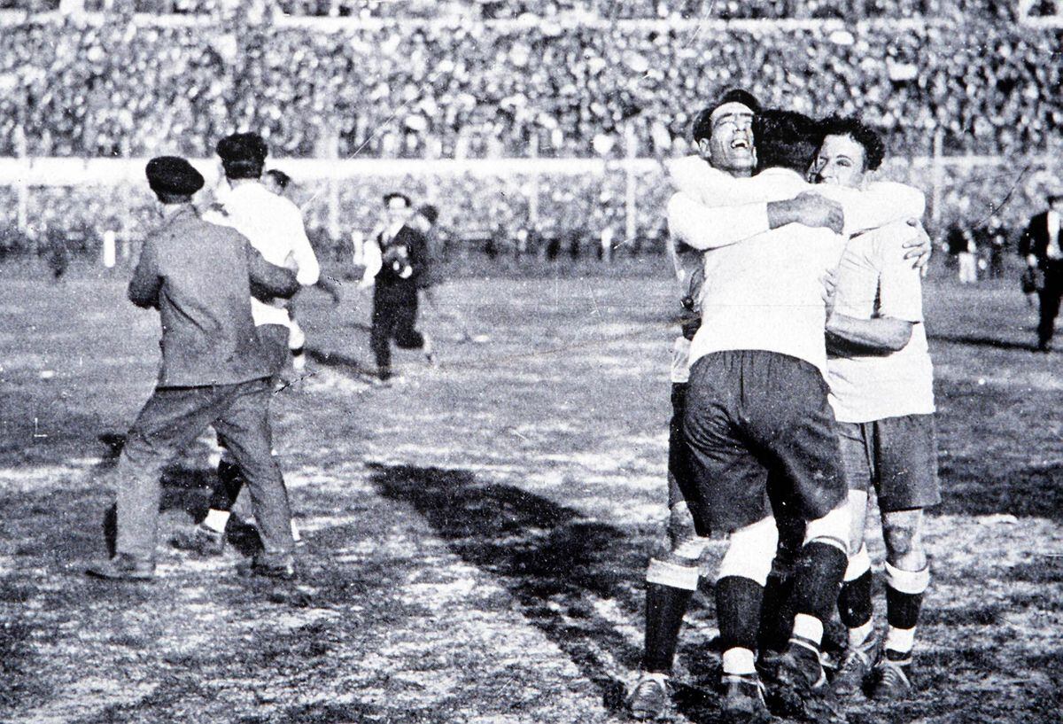 World Cup Final, 1930, Montevideo, Uruguay, Uruguay 4 v Argentina 2, Members of the the Uruguayan team celebrate after Winning the Jules Rimet trophy by beating rivals Argentina in the first ever World Cup Final  (Photo by Popperfoto/Getty Images)