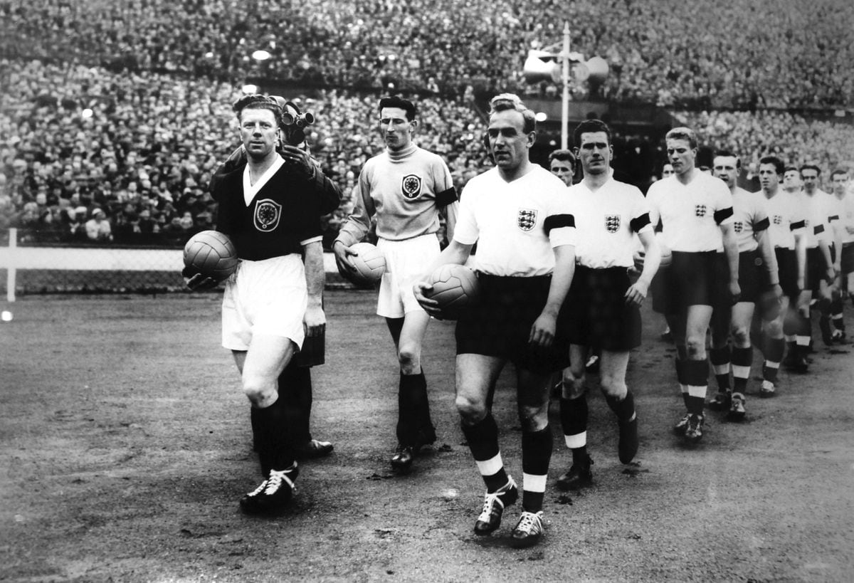 Billy Wright leads out the England team for his 100th cap followed by Ron Flowers (3rd in line) and Peter Broadbent (5th in line).