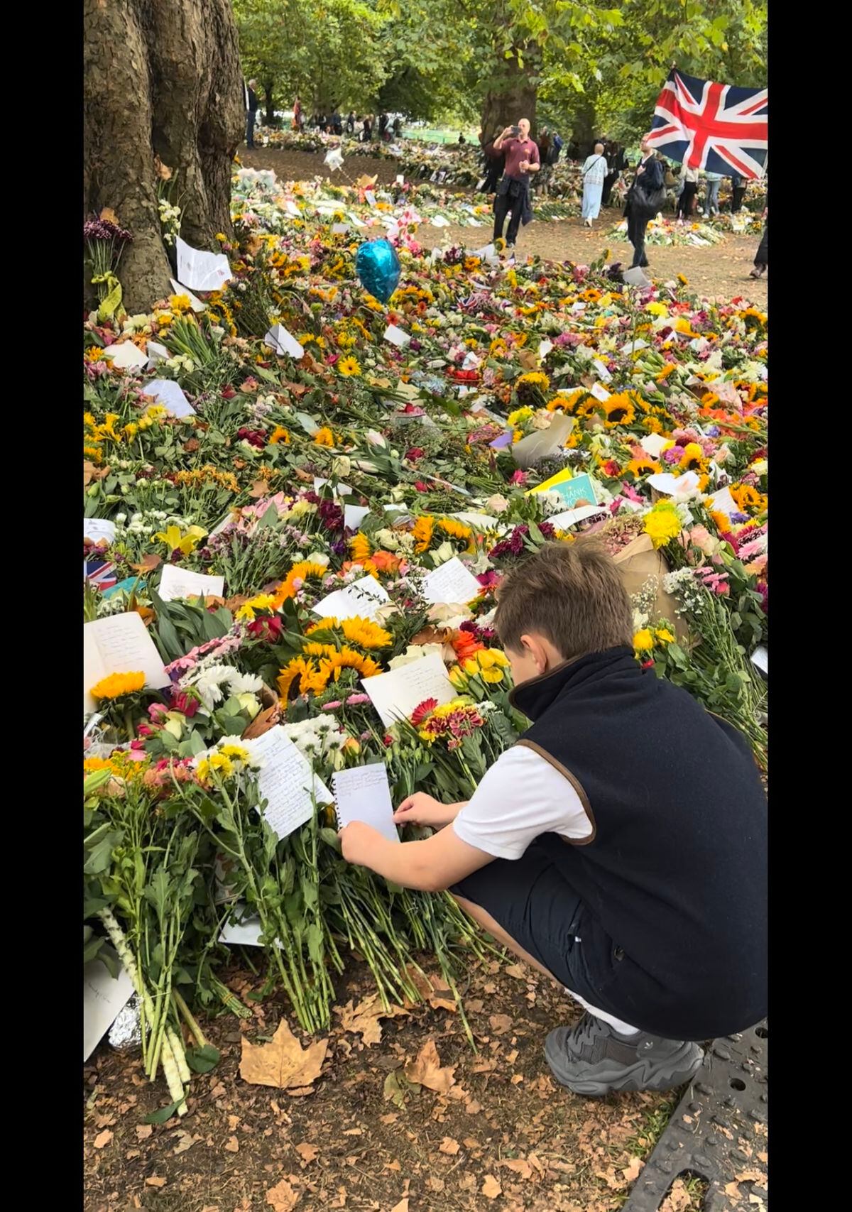 Harrison Reilly places his note among the tributes