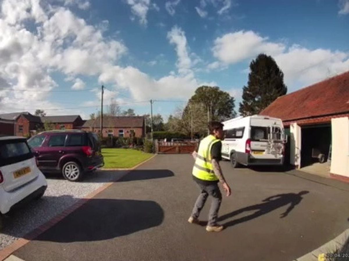 Watch: Delivery driver vaults over gate to escape the wrath of a tiny sausage dog 