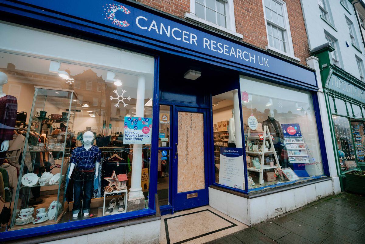 Blue Cross and Cancer Research UK had to board up their doors after glass panels were smashed.