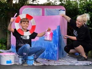 Reuben Bailey, 11, and his mother Sam painting their ship ahead of Ellesmere Carnival