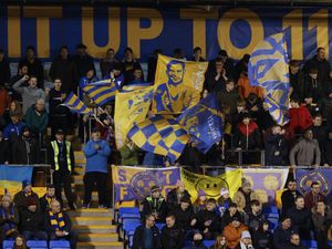 Some of the banners and flags set up by South Stand Flags in Shrewsbury's safe standing section (AMA)