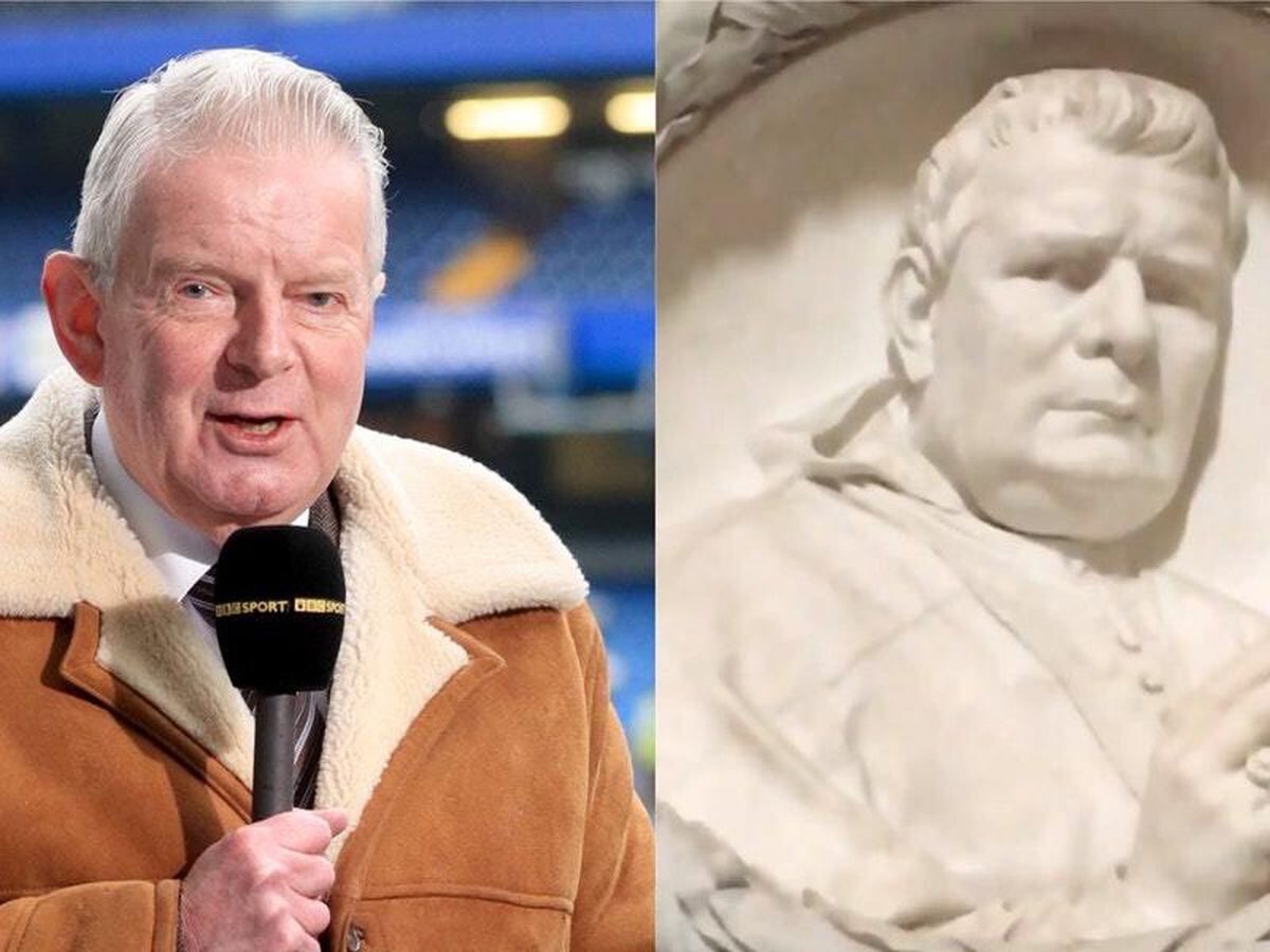 Former BBC football commentator John Motson and a bust in Italy