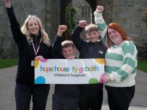 Katie Rees-Jones, Senior Volunteer and Community Officer at Chirk Castle (far left) with Mia's mum Martine and her brothers Liam and Kyle. 