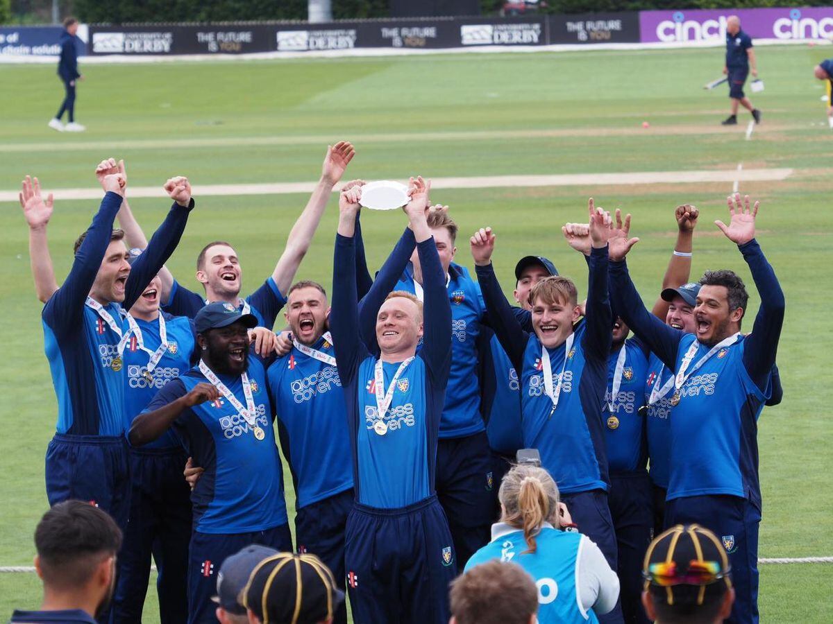 Wellington celebrate winning their third trophy of the season, and the club's first national title, at the Derbyshire County Ground. Pics John Pilkington.