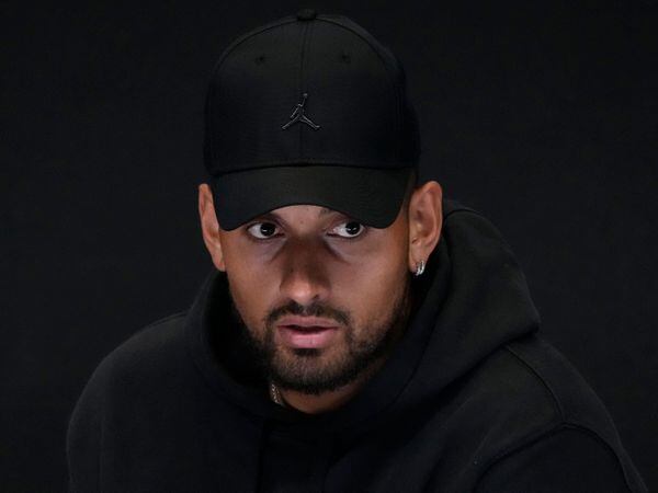 Australia’s Nick Kyrgios reacts as he announces his withdrawal from the Australian Open with a knee injury at a press conference in Melbourne, Australia on Jan. 16, 2023