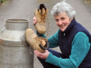 BORDER WORDS REPORTERS. Helen Francis prepares for this years Trefonen Hill Walk.PIC BY MARK BOOTH 25/4/14 (**THE MILK CHURN IS SOMETHING TO DO WITH THE WALK APPARANTLY**).