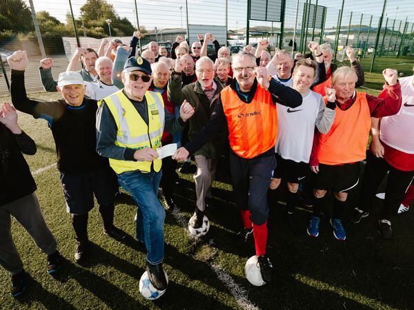 Dennis Briggs receives a cheques from Telford Stags Walking Football Club for the Shropshire Prostate Cancer Support Group. 