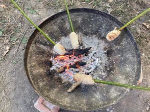 Cooking bread on a stick in the Fire and Food family activity. Picture: Shropshire Hills Discovery Centre