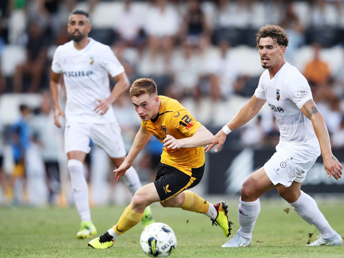 FARO, PORTUGAL - JULY 31: Connor Ronan of Wolverhampton Wanderers runs with the ball during the Pre-Season Friendly between SSC Farense and Wolverhampton Wanderers at Estadio Sao Luis on July 31, 2022 in Faro, Portugal. (Photo by Jack Thomas - WWFC/Wolves via Getty Images).