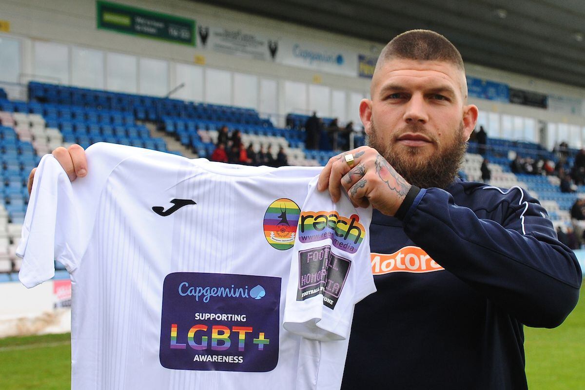 Shane Sutton with the club's special Football vs Homophobia strip 