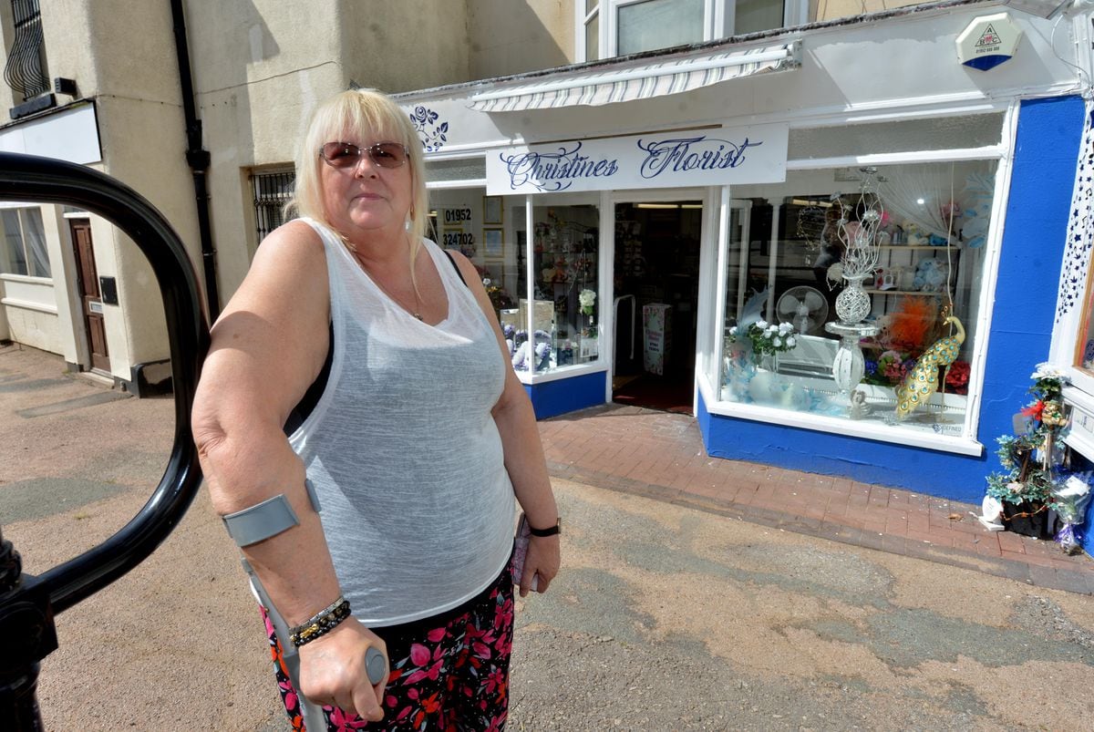 LAST COPYRIGHT SHROPSHIRE STAR STEVE LEATH 08/07/2022..Pic in Oakengates of business on and around the Limes Walk area, where there are proposals to demolish one building and turn other business's upstairs rooms into flats. Christine Orford from Christines Florists..