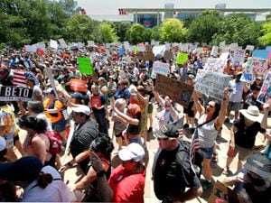 Protesters hold a rally at Discovery Green Park, across the street from the National Rifle Association Annual Meeting held at the George R. Brown Convention Center Friday, May 27, 2022, in Houston.
