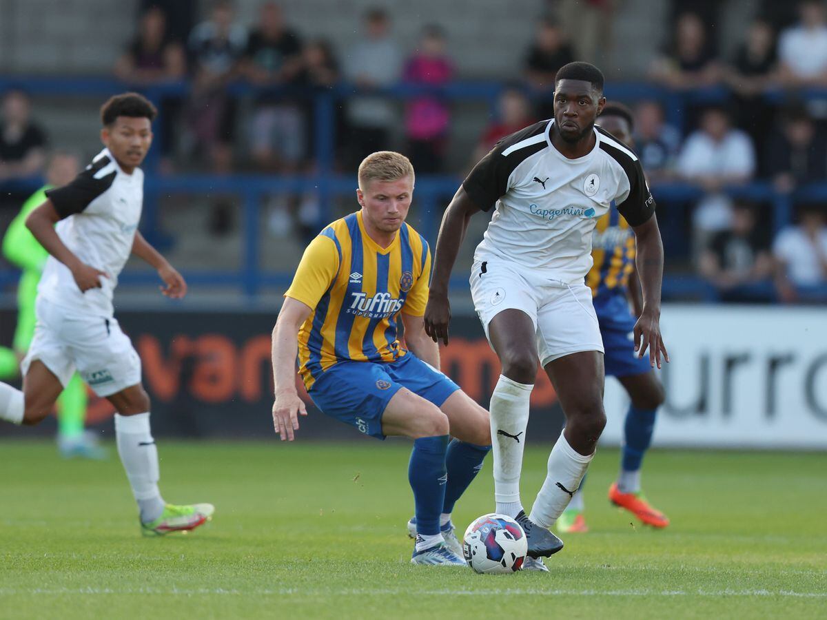 Nate Blissett of AFC Telford United and Taylor Moore of Shrewsbury Town (AMA)