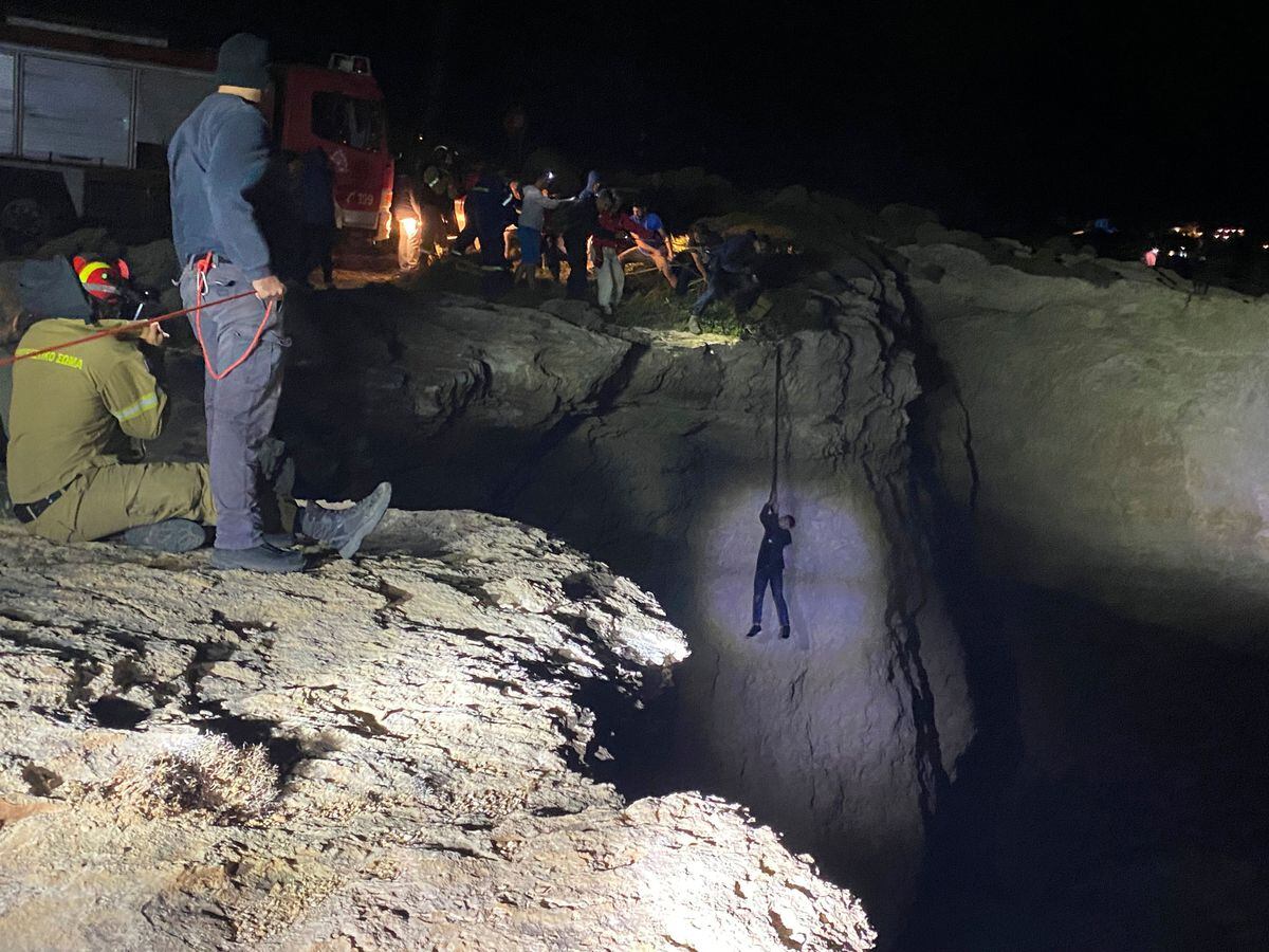 A migrant is saved during a rescue operation on the Greek island of Kythira