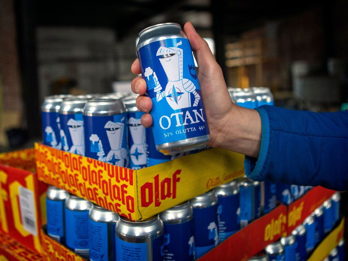 Beer cans inspired by the Nato logo of Olaf Brewing Company on display in Savonlinna, eastern Finland