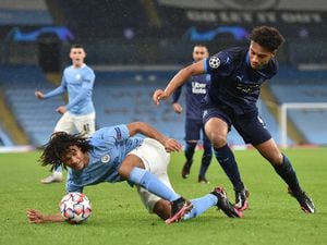 Manchester City's Nathan Ake (left) and Marseille's Boubacar Kamara battle for the ball during the Champions League match at the Etihad Stadium, Manchester..
