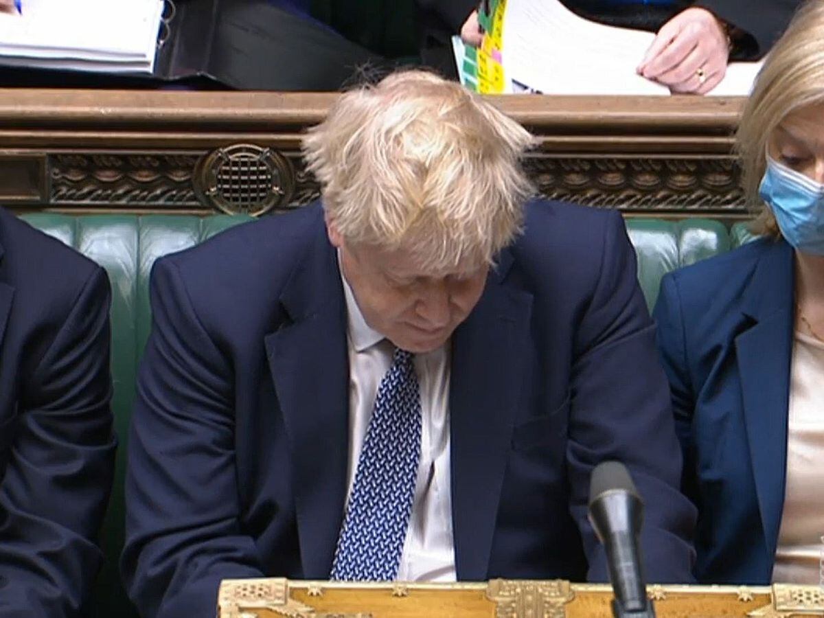 Prime Minister Boris Johnsons stairs down while seated in the Commons
