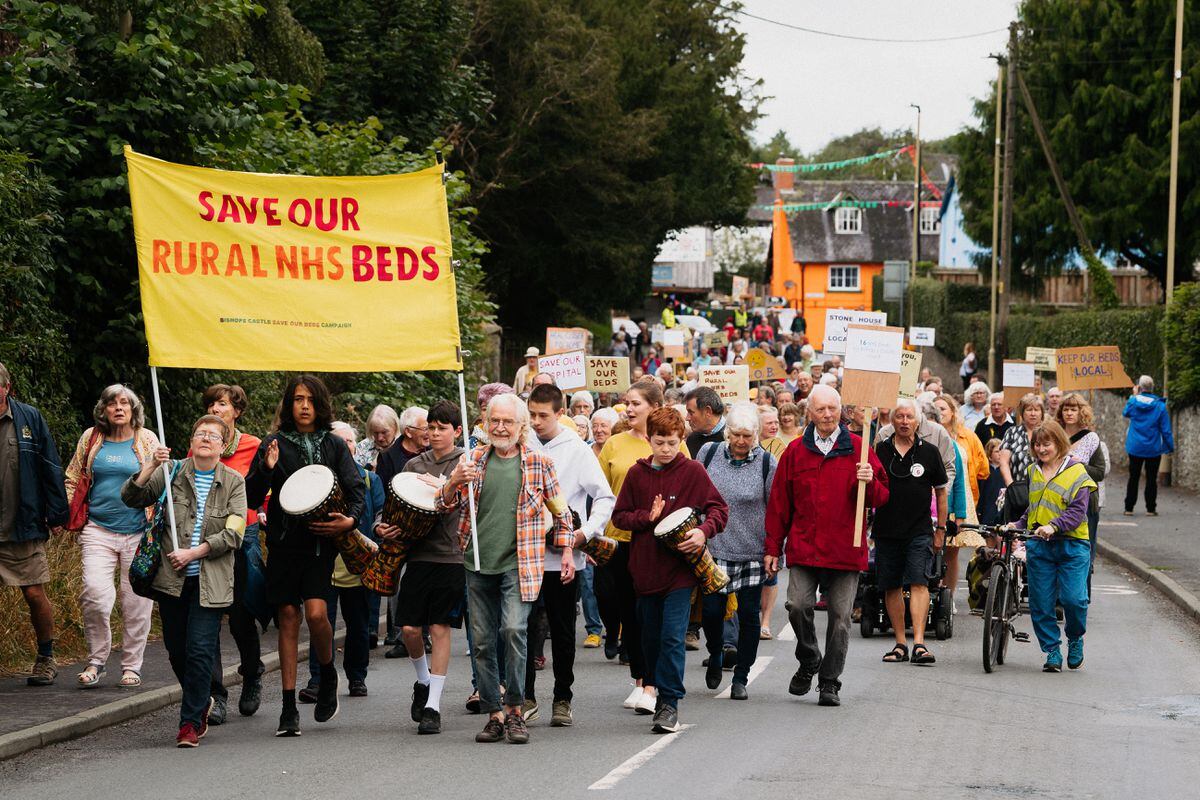 Campaigners and residents have marched in Bishop's Castle calling for health bosses to re-open inpatient beds at their hospital.
