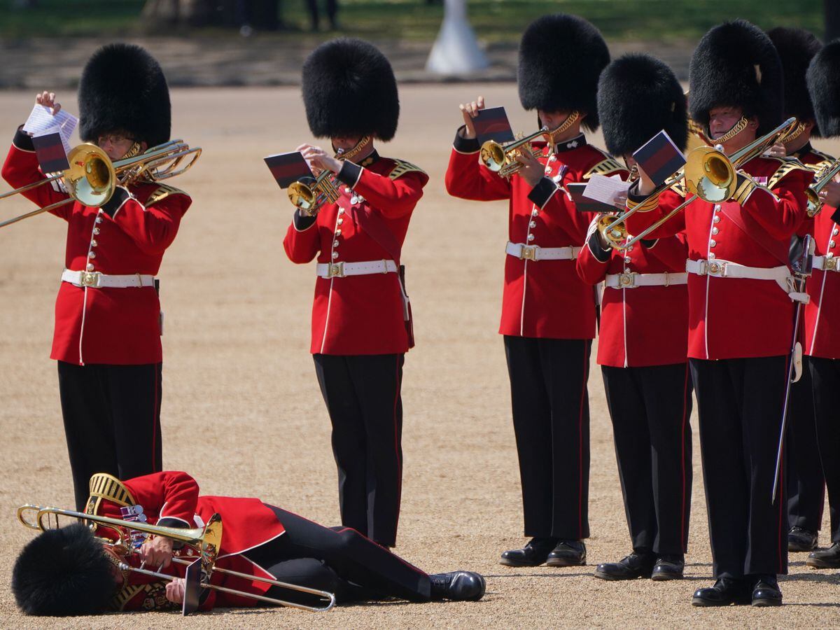 A trombone player in the military band faints during the Colonel’s Review, for Trooping the Colour, at Horse Guards Parade in London