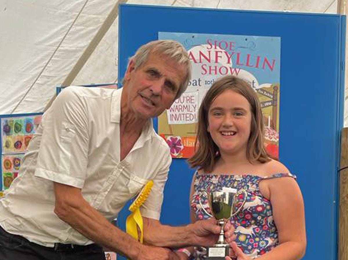 Show President Ianto Jones presents Darcey Lloyd with the childen's cup