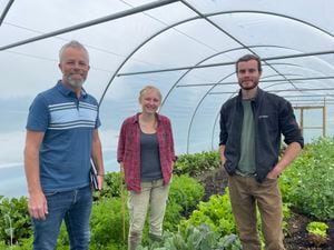Paul Newman, left, of Be A Better Fish, with Yas and Joel of the Good Pickings market garden in Babbinswood