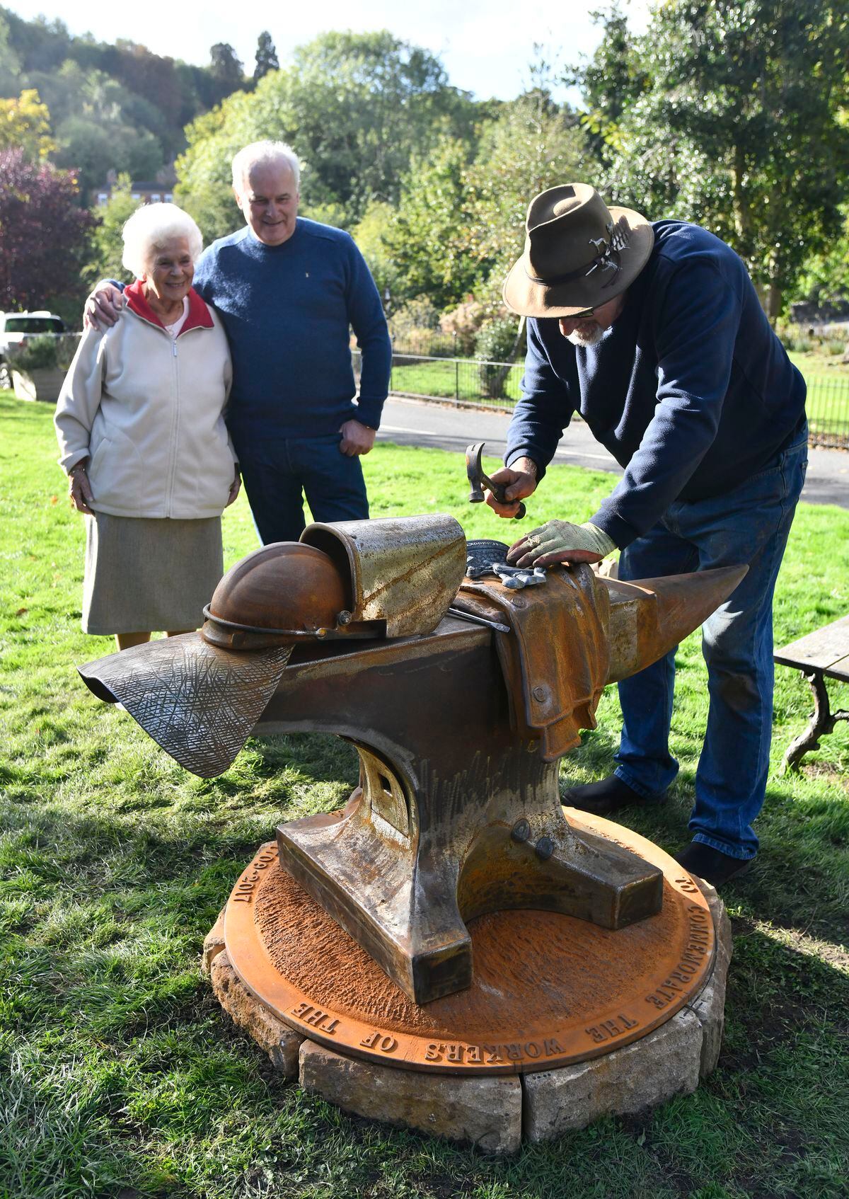 Former foundry workers mother and son Irene and Glyn Baker watch sculptor Chris Wright installing the sculpture commemorating Men of Iron that worked at Coalbrookdale Foundry at Coke Hearth. Picture: Dave Bagnall