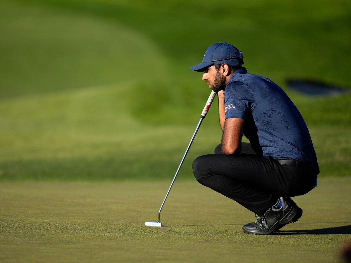 Aaron Rai, of England, waits to putt on the ninth hole of the North Course at Torrey Pines during the first round of the Farmers Insurance Open golf tournament on Wednesday