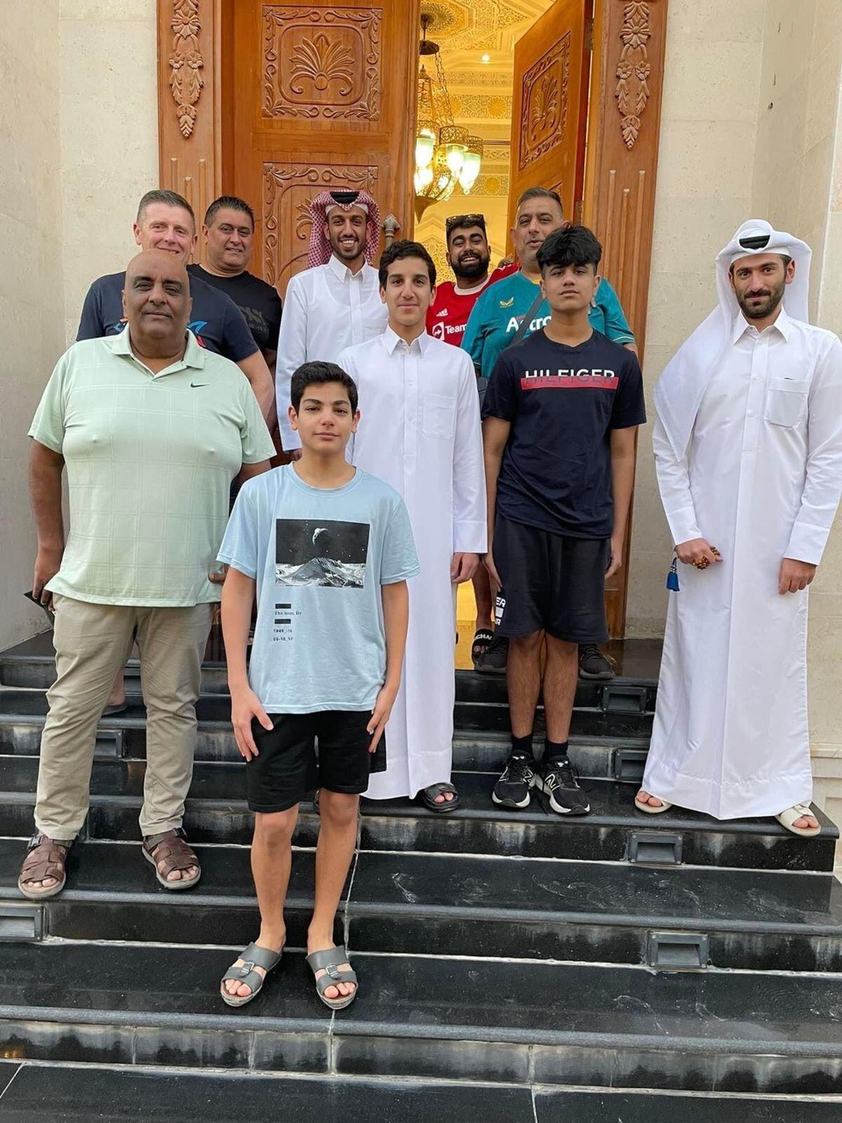 Jassa Dehal, Harjit Dheil, Kevin Briggs, Indi and Aran Dheil, outside the home of the Qatari resident who invited them to his house and showed fantastic hospitality