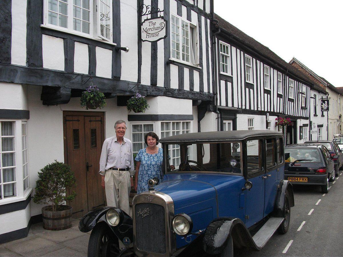 Jonathan and Rosemary Wood - before his stroke in 2019 - outside The Merchant House in Lower Corve Street, with Jonathan’s beloved 1928 Austin 16, which he bought for £15 when he was 17.