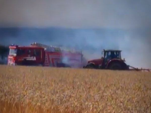 The video shows a tractor next to a fire engine. 