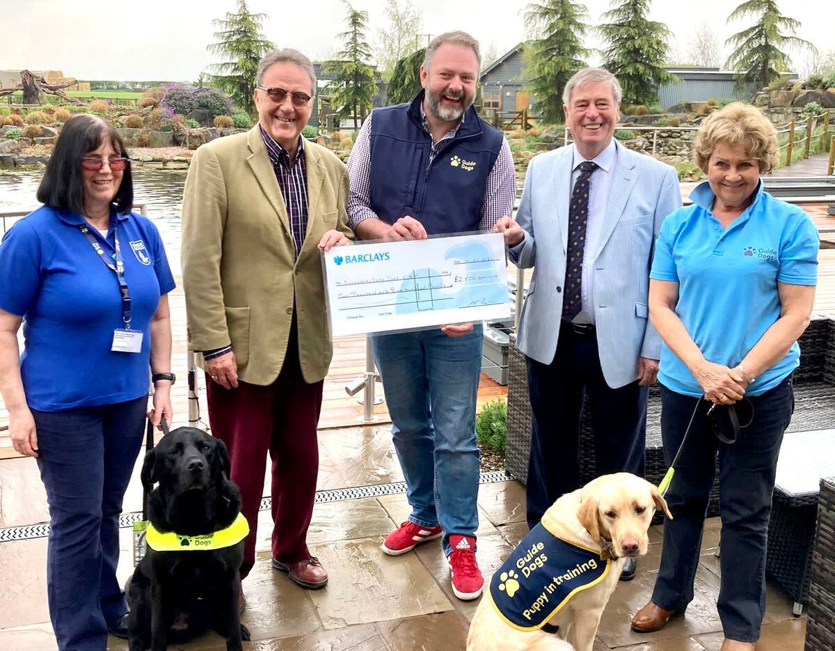 (L-R) Lindsey Rowlands and guide dog Leyland; Worshipful Brother Allen Cadman of SMCA; Dan Myatt from Guide Dogs; Worshipful Brother Peter Robinson SMCA; Sue Nicholas and guide dog puppy Swannie
