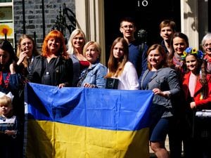 A number of Ukrainian families stand on the doorstep of 10 Downing Street after they met with Prime Minister Boris Johnson after arriving to the UK through the UK visa scheme
