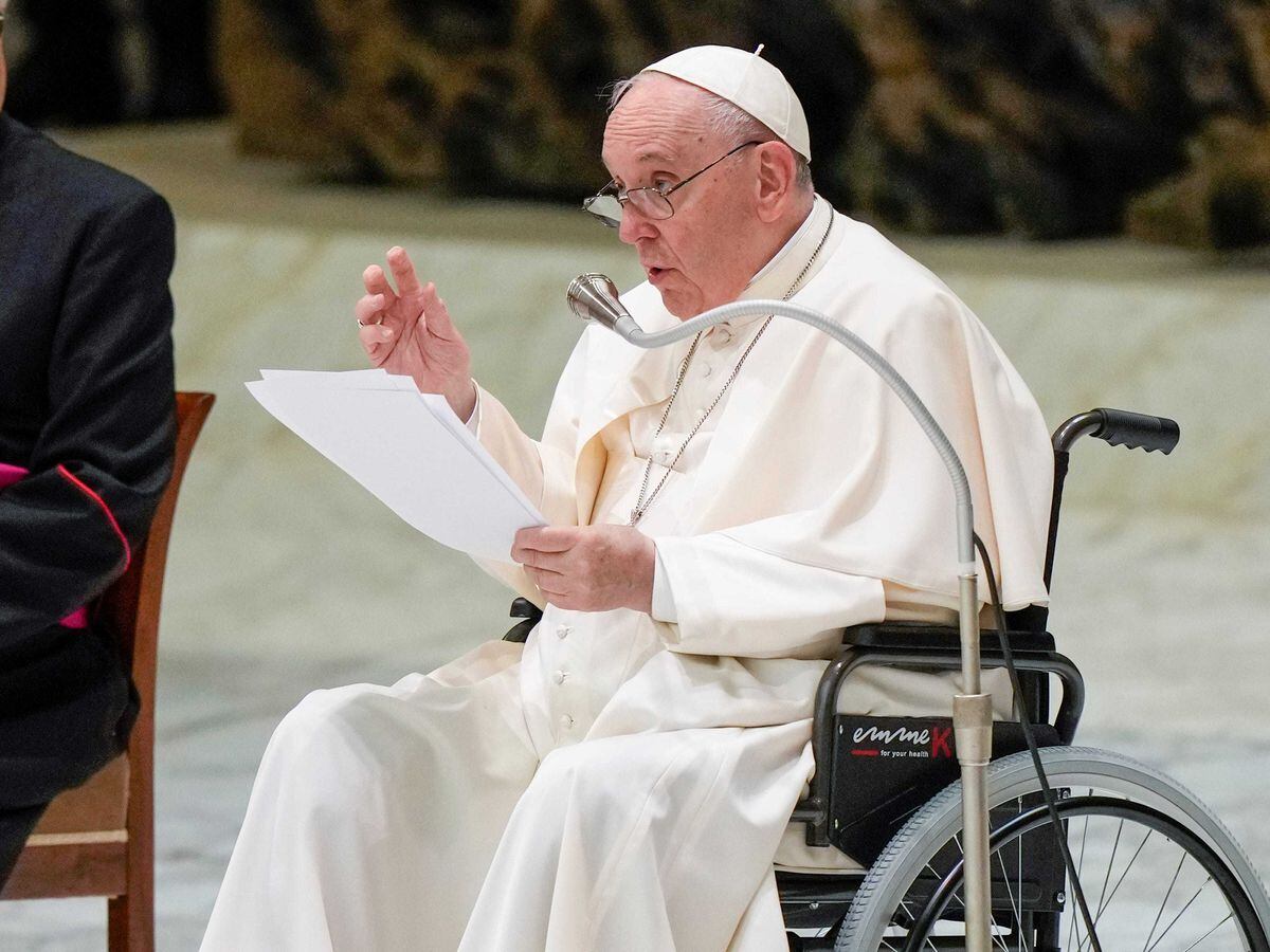 Pope Francis in a wheelchair delivers his address during an audience with members of the Italian Civil Aviation Authority in the Paul VI Hall at The Vatican on Friday May 13 2022