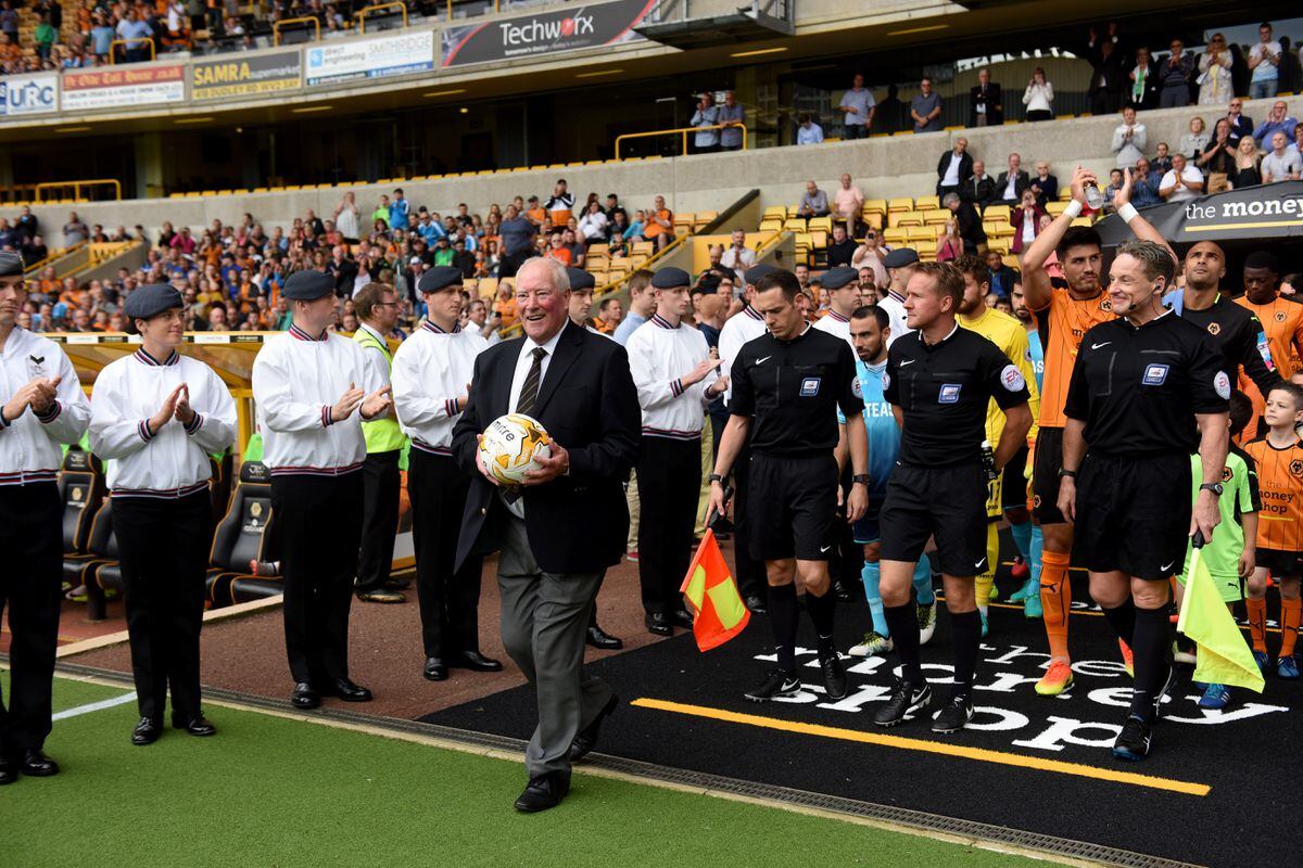 Former Wolverhampton Wanderers and England footballer Ron Flowers carrying the match ball. (AMA)