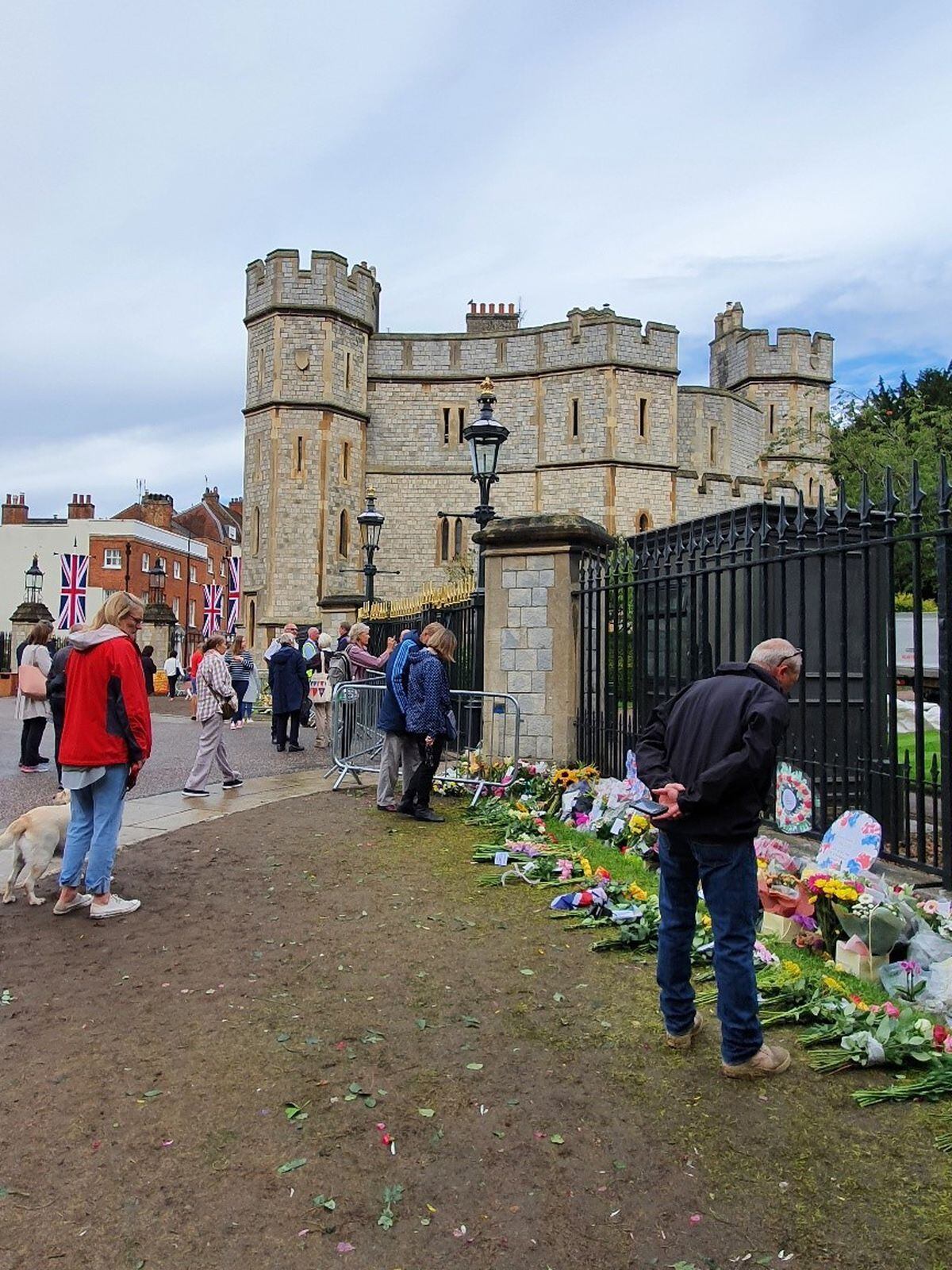 Dawn gathered with mourners outside Windsor Castle to pay respects to Her Majesty, Queen Elizabeth II. Photo: Dawn Hughes