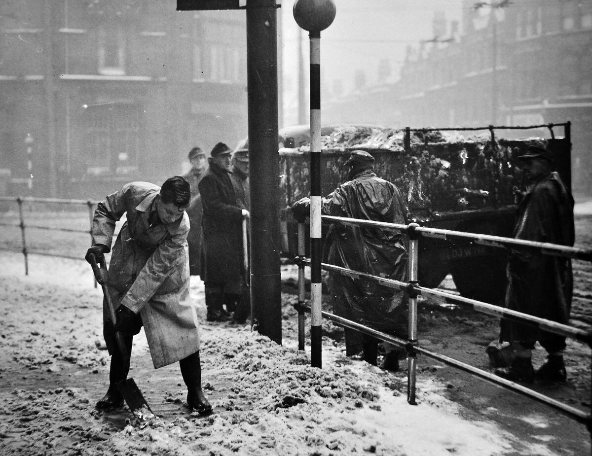 A German POW clearing snow in Princes Square, Wolverhampton, in January 1947.