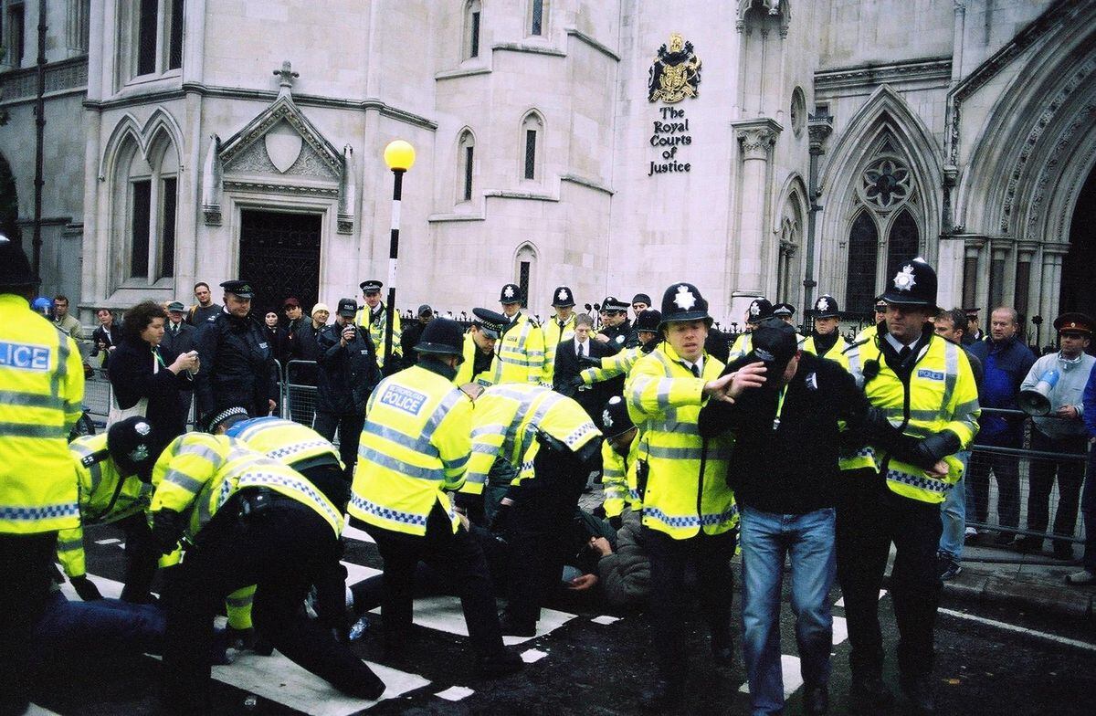 Police break up a demo outside the Royal Courts of Justice in 2003