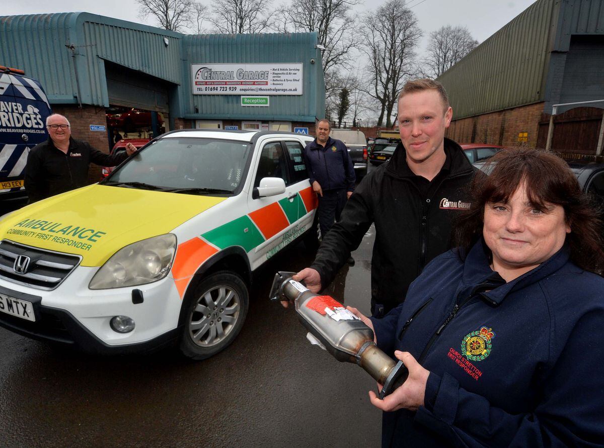 John Mackenzie from Central Garage with Tracey Prosser from the First Responders, whose car is being fixed for free