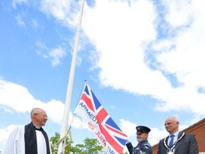 Attending an Armed Forces Day flag raising event, (left-right) reverend Chris Thorpe, corporal Alan Ashall, and the mayor of Shifnal councillor Roger Cox, at Shifnal Village Hall