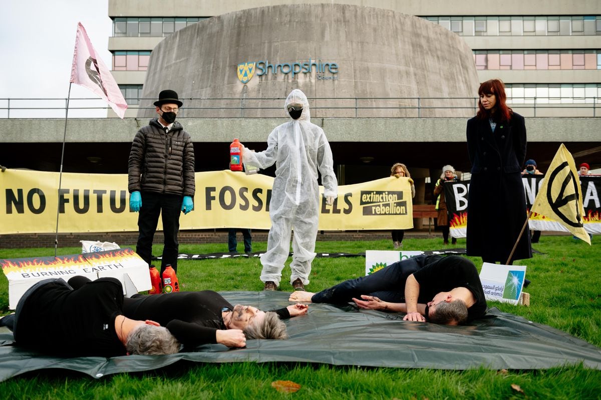 Campaigners staged an 'oil pour' protest ahead of the pension fund vote.