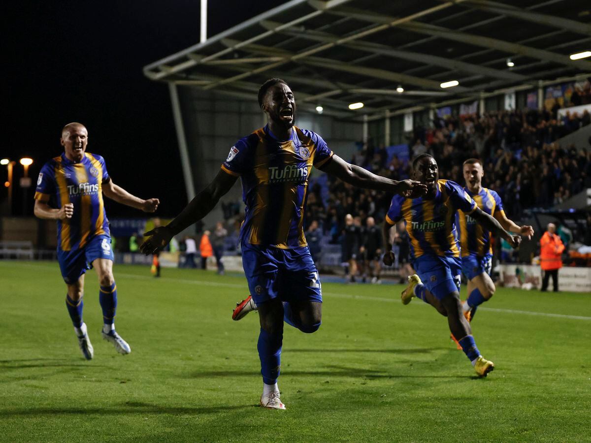 Chey Dunkley of Shrewsbury Town celebrates after scoring a goal to make it 3-2.