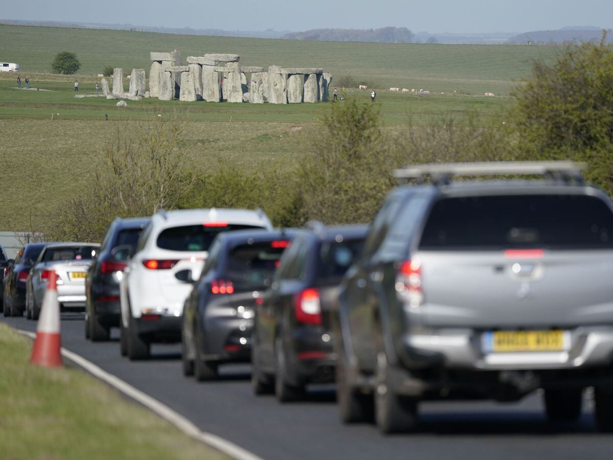Traffic passes Stonehenge