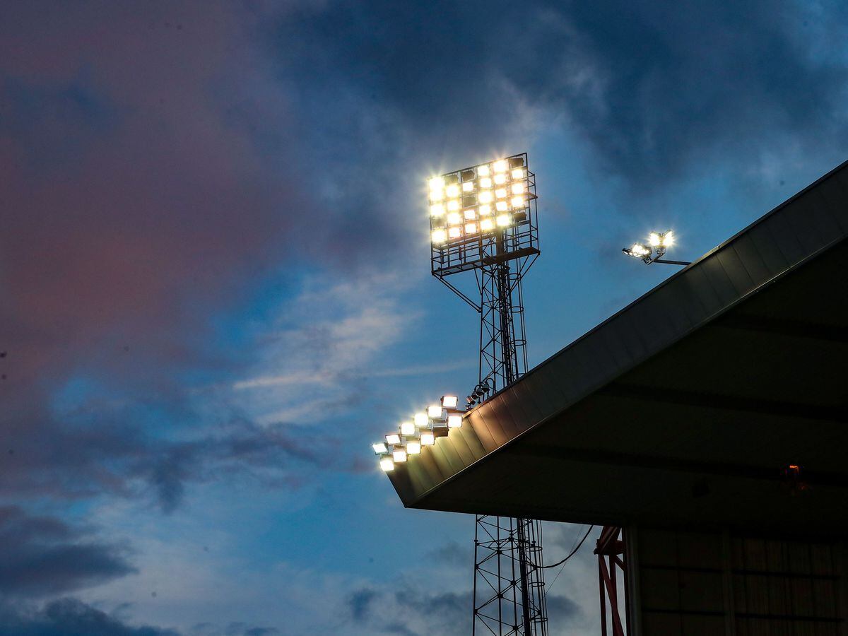 Floodlights illuminate a stadium