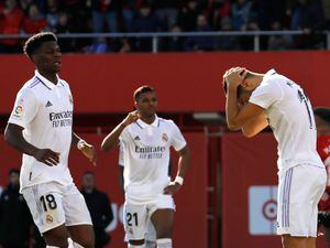 Real Madrid’s Marco Asensio (right) reacts after missing a penalty