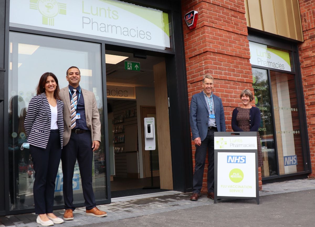 At the opening of the new home for Lunts Pharmacy are Ravi and Anj Nagra with Martin and Christine Lunt
