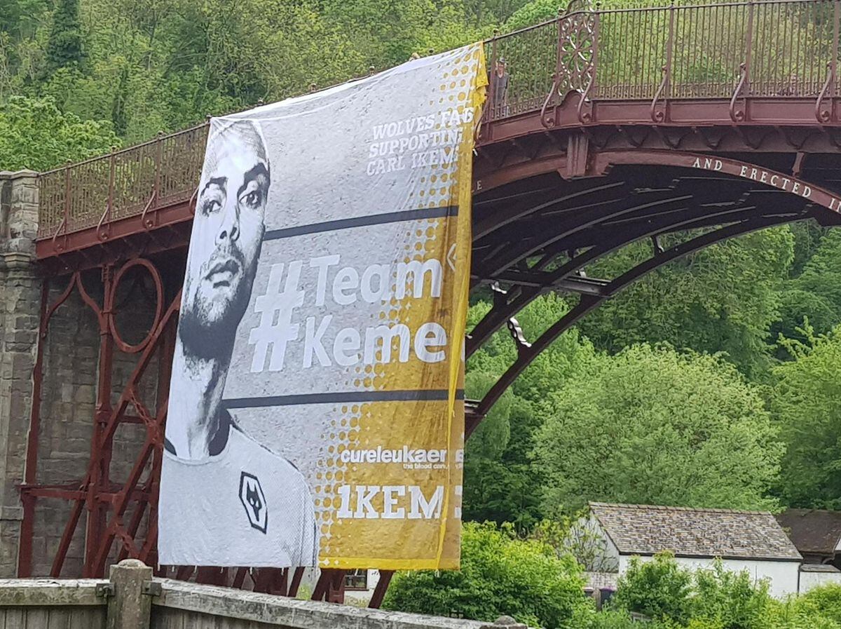 The Carl Ikeme banner hangs from the Iron Bridge